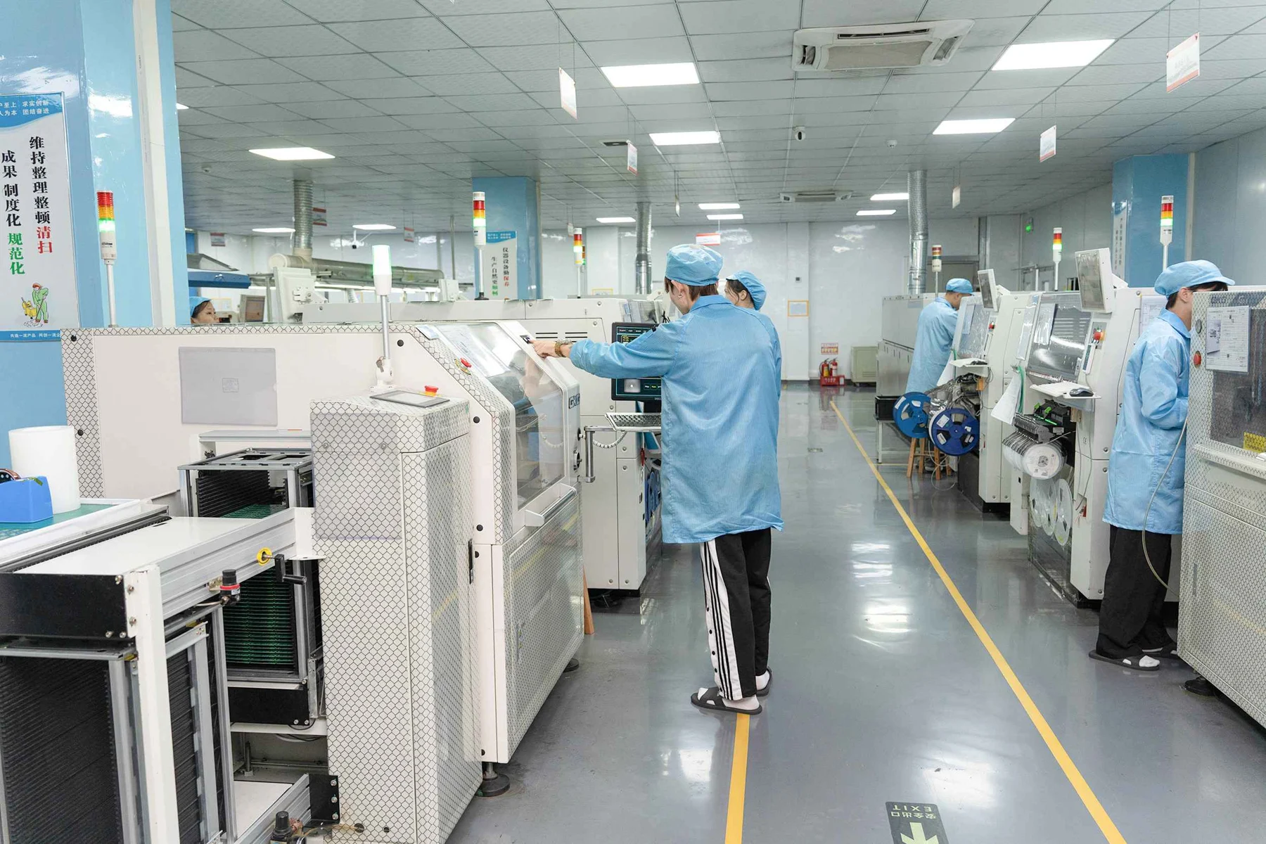 Electronics manufacturing line with SMT assembly equipment